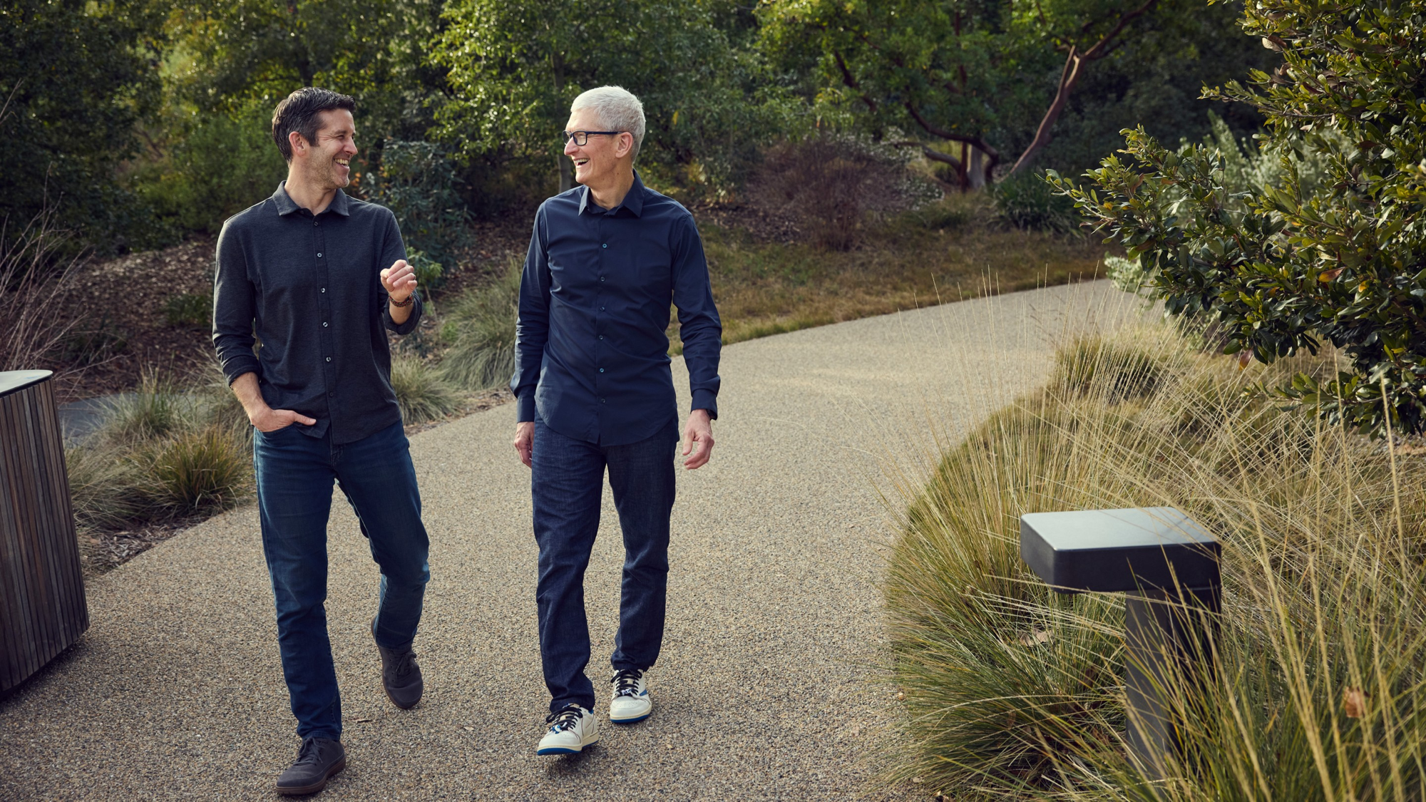 Tim Cook and John Ternus walking together at Apple Park